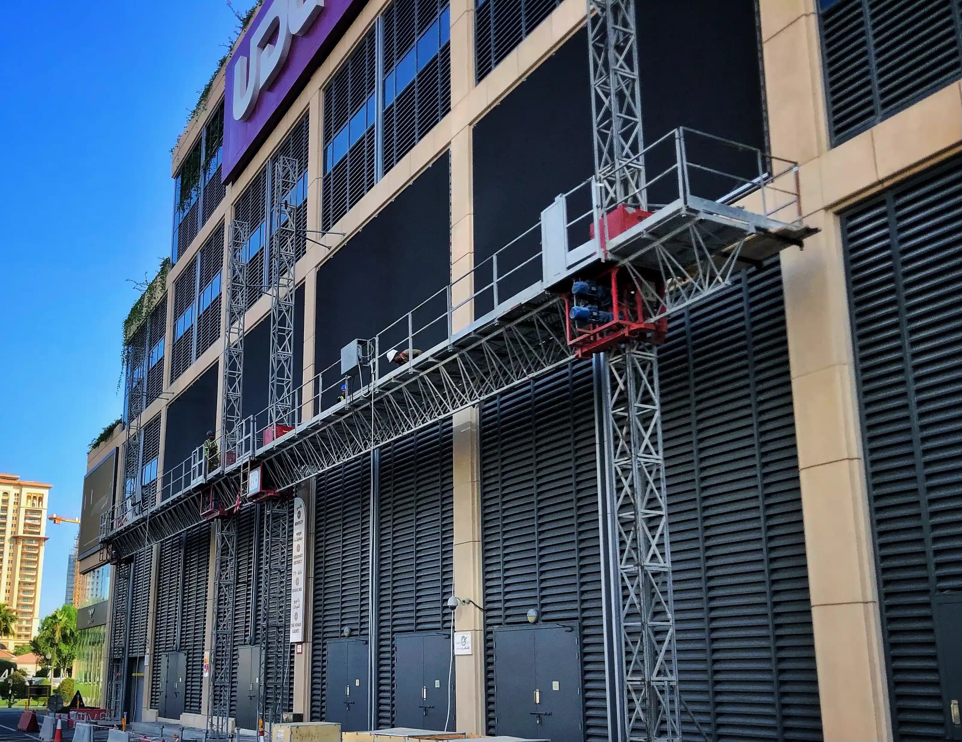 Mast climbing work platform used in high-rise construction