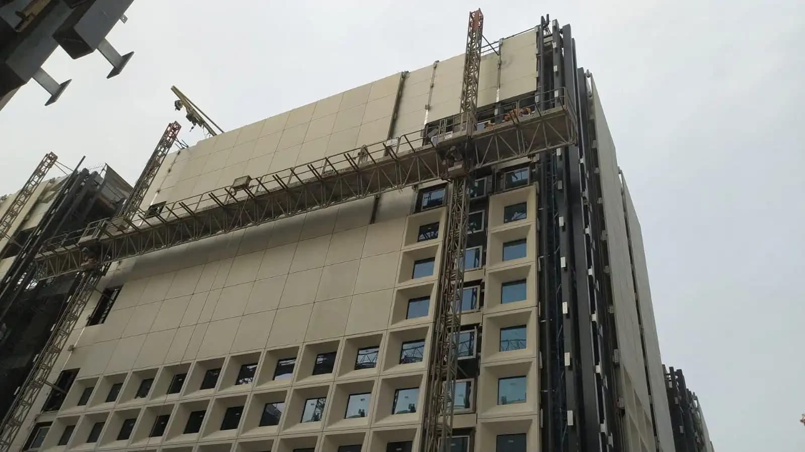 Mast climber rental in Qatar for facade construction